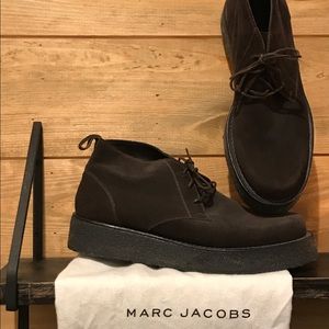 Dark brown suede chukkas.